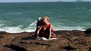 busty blonde tourist takes anal from locals on rocks