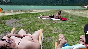 Voyeur touches himself on beach while I flash nearby