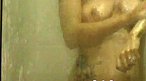 voyeur spies on amateur brunette washing hair in shower