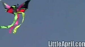 Teen Little April rubs clit outdoors while sucking popsicle