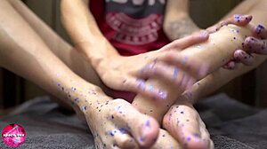 I give a sensual footjob to the rubber cock.