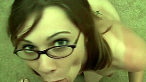 She looks at you with glasses, grabs your ass, then blows your cock until it collapses