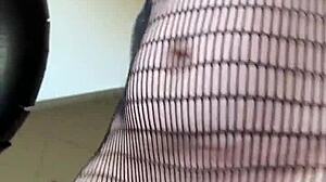 Brunette in fishnets starts a sexy fetish workout with athletic moves. Her small tits bounce during intense action.