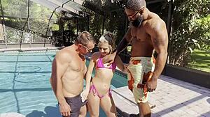 petite cheerleader kait gets wild in interracial pool threesome fun
