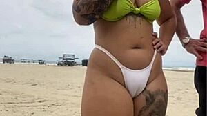 Young African Exhibitionist Flashes Pussy at Beach Vendor