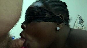 the black wife eagerly sucks her husband's dick, letting him cum in her mouth