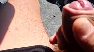 This skinny bodybuilder guy gets a crazy public handjob from the old cuckold fetish friend. Spitting and feet play make it wild in the open.