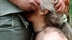 Slave girl gets trained in the forest with sodomy and cum in her mouth.