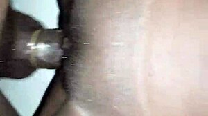 She feels intense pleasure enjoying the big black cock deep inside her.