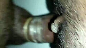 She feels intense pleasure enjoying the big black cock deep inside her.