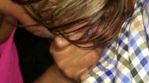 Mature tattooed blonde milf sucks petite young cock outdoors in public.