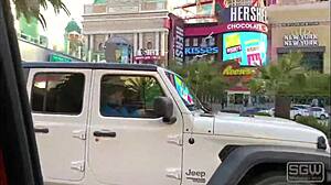 A couple enjoys road head on the bustling Las Vegas Boulevard with blowjobs and wet pussy action