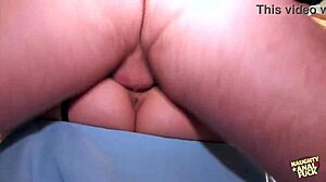 French woman uses hands to handle large object intriguingly