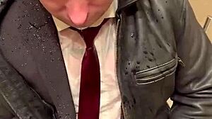 Men in leather suits play at the office