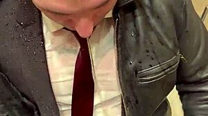 Men in leather suits play at the office