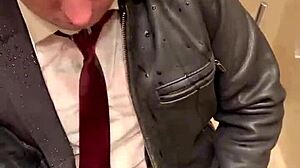 Men in leather suits play at the office