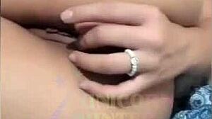 A curvy latina teen rubs her pussy then fingers her ass on the bed.