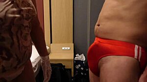 femdom bitch slaps erect cock over bloomers