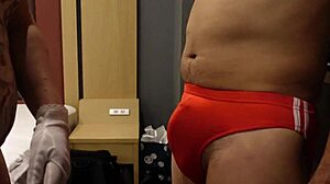 femdom bitch slaps erect cock over bloomers