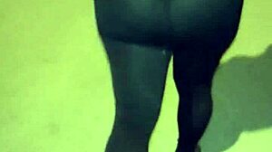 Mature woman with huge ass in transparent leggings walks the street