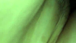 Bent over in doggystyle position, contrasting pleasure and submission