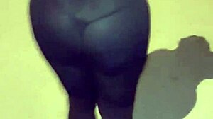 Mature woman with huge ass in transparent leggings walks the street