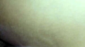 Bent over in doggystyle position, contrasting pleasure and submission