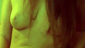 Young babe fingers her wet pussy with a toy