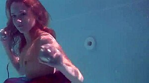 i adore redhead babe nikita vodorezova stripping naked underwater in pool