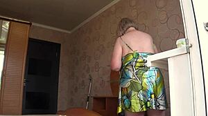 Neighbor spies on chubby milf with saggy natural tits and fat legs through open window in homemade pawg scene. She spreads wide behind the scenes.