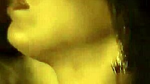 Beautiful brunette undresses gracefully in an erotic dance