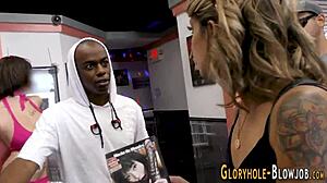 that dirty skank is blowing that hard black dick so good at the gloryhole