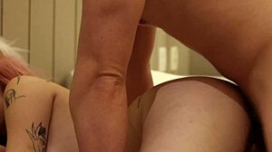 straight-jacket babe with pink hair and muscular bodybuilder tits