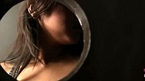 Beautiful Adrianna Masturbates While Jerking Off a Big Cock from a Hole in the Wall