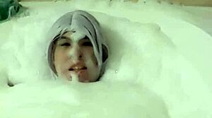 Cyno enjoys a suggestive bubble bath in cosplay costume