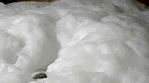 Cyno enjoys a suggestive bubble bath in cosplay costume