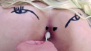 Pink asshole sucks lollipop in sheer red