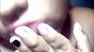 Pregnant latina masturbates while watching voyeur cum on her big tits.