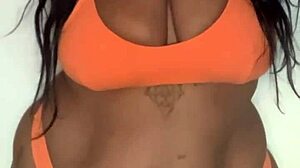 check out this horny ebony milf slut in bikini dancing with big tits ass boobs natural tits big ass whore moves