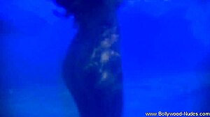 Brunette babe from wild india teases softly with erotic undressing and striptease in a captivating dance routine.