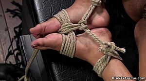 Ebony slave bound in extreme hogtie endures rough pussy toying and bizarre pain