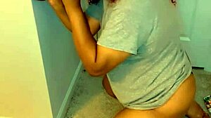 Crossdresser drops to knees and sucks a big black cock dildo in transsexual play