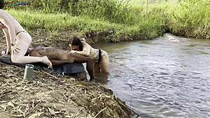 Outdoor Sunbathing Sex by River with Two Hot Babes Sucking and Creampie