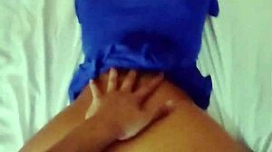 I love showing off my beautiful big ass in this tight blue dress while lying on the bed.