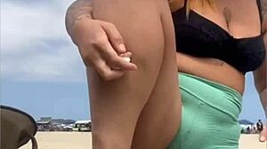 The young guy hadn't even fucked her swollen pussy yet when he suggested bringing a friend to join them on the beach for more.
