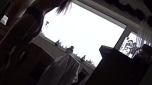 Mrs Scarlet teases in kitchen with stockings and heels during subtle underwear voyeur moment.