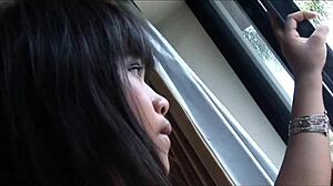 Two lesbian asian milf have sex at bed with strapon anal and fishnets assplay.