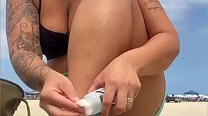 The young guy hadn't even fucked her swollen pussy yet when he suggested bringing a friend to join them on the beach for more.