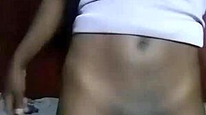 Horny Kenyan crossdresser strips down and fingers wide-open asshole in solo play.