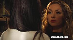 busty lesbian slave with big natural boobs tied up and intimately touched by dominant mistress in bondage